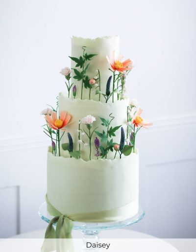 Green pastel wedding cake with wild meadow sugar flowers