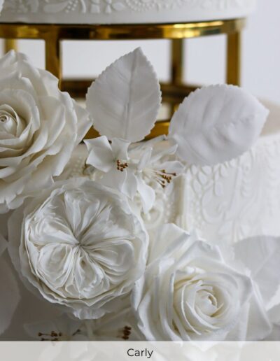 Handcrafted white sugar flowers with botanical detail on a luxury bespoke wedding cake created for a large cultural wedding in Doncaster