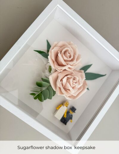 Sugar flower shadow box keepsake created from handcrafted wedding cake flowers for a West Mill wedding